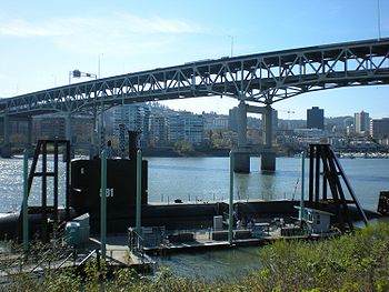 Marquam Bridge with OMSI sub in foreground. View from eastside greenway.